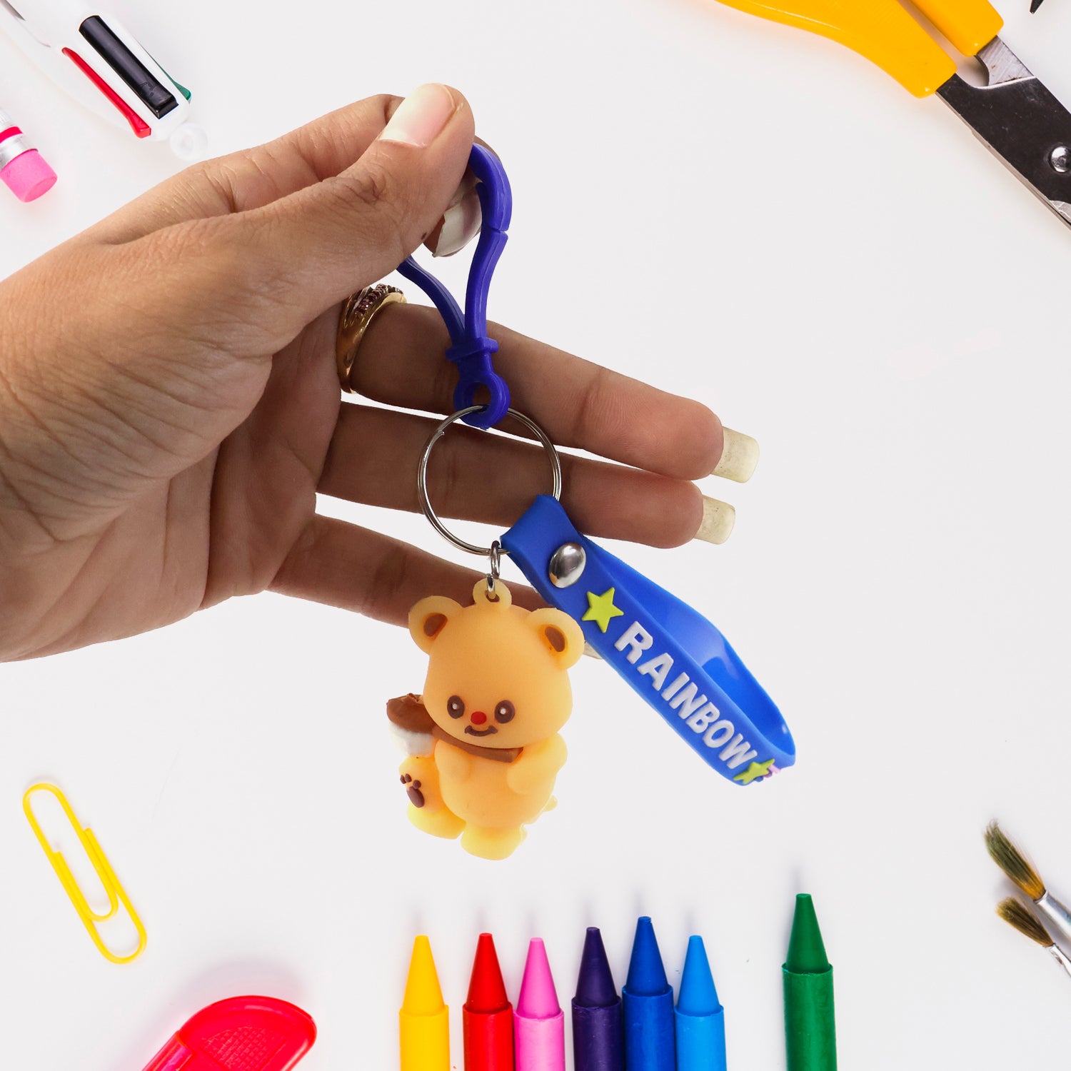 Cute bear character keychain by Wukusy featuring a plush bear with a smiling face and a metal keyring attachment.