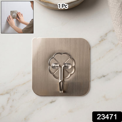 Wukusy self-adhesive plastic wall hook attached to bathroom wall for hanging towels or accessories.