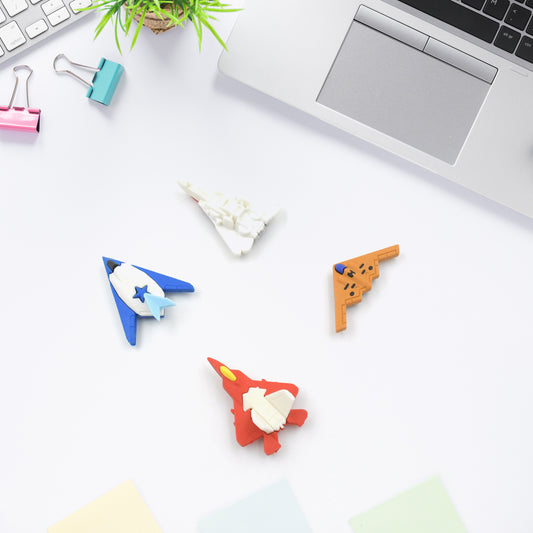 Set of four Wukusy plane-shaped erasers for kids, colorful and cute, designed for school and art use, ideal as birthday gifts.