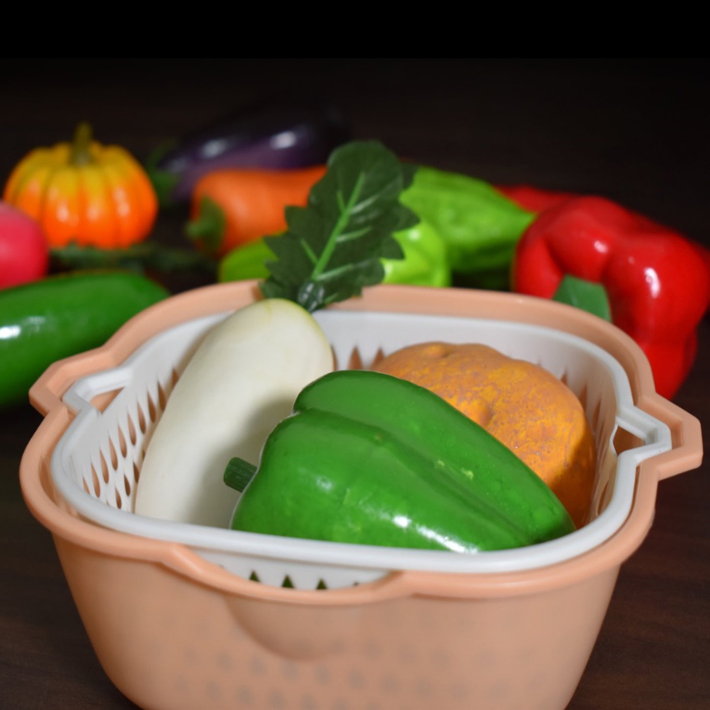 Wukusy 2-in-1 basket strainer used for rinsing fruits, vegetables, and other items with a mesh design in the image.