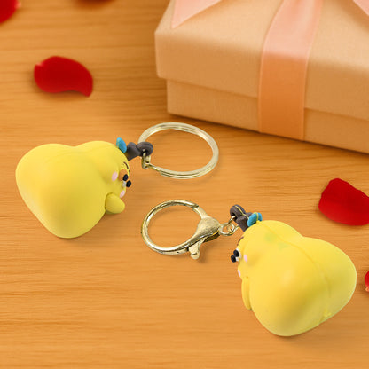 Cute cartoon couple keychain toy from Wukusy featuring colorful, playful figures hanging together.