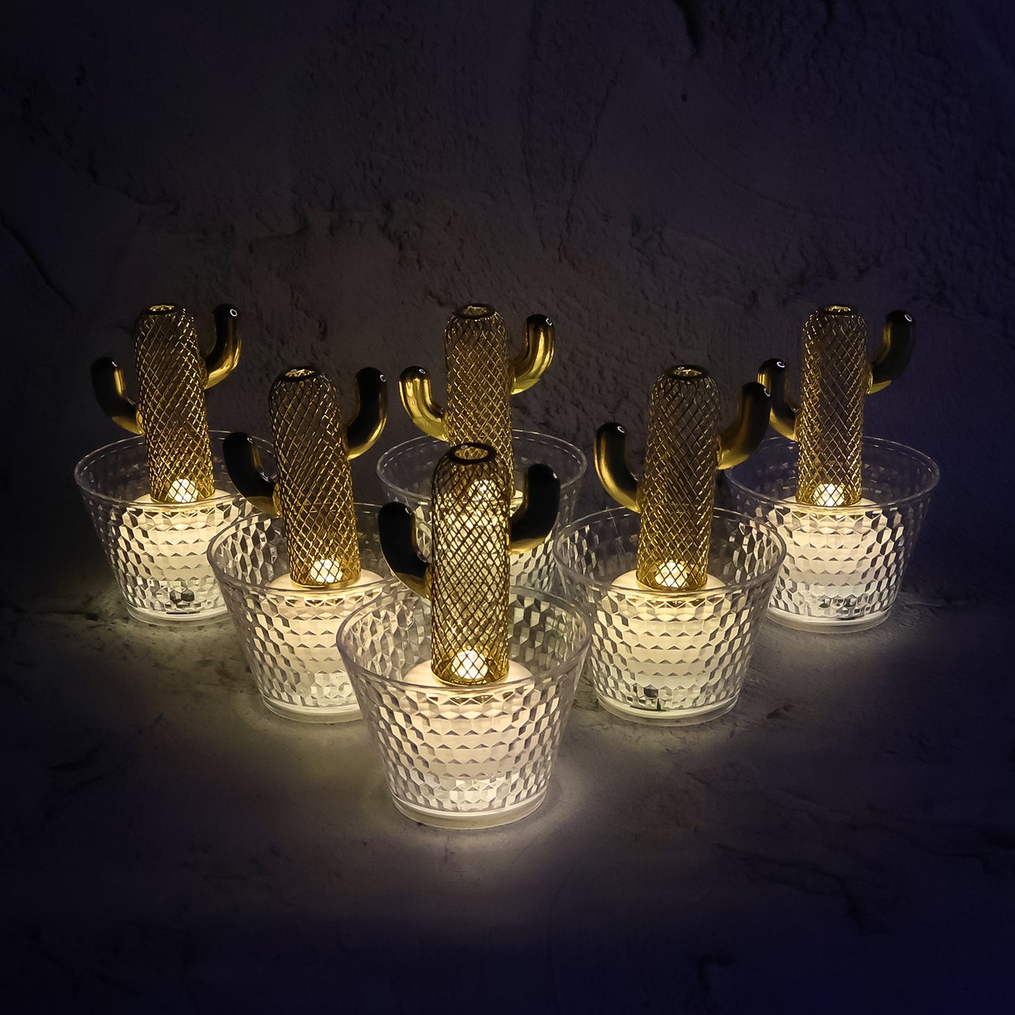 Six Wukusy LED flameless decorative candles arranged in a cozy home decor setting, showcasing warm ambient lighting.