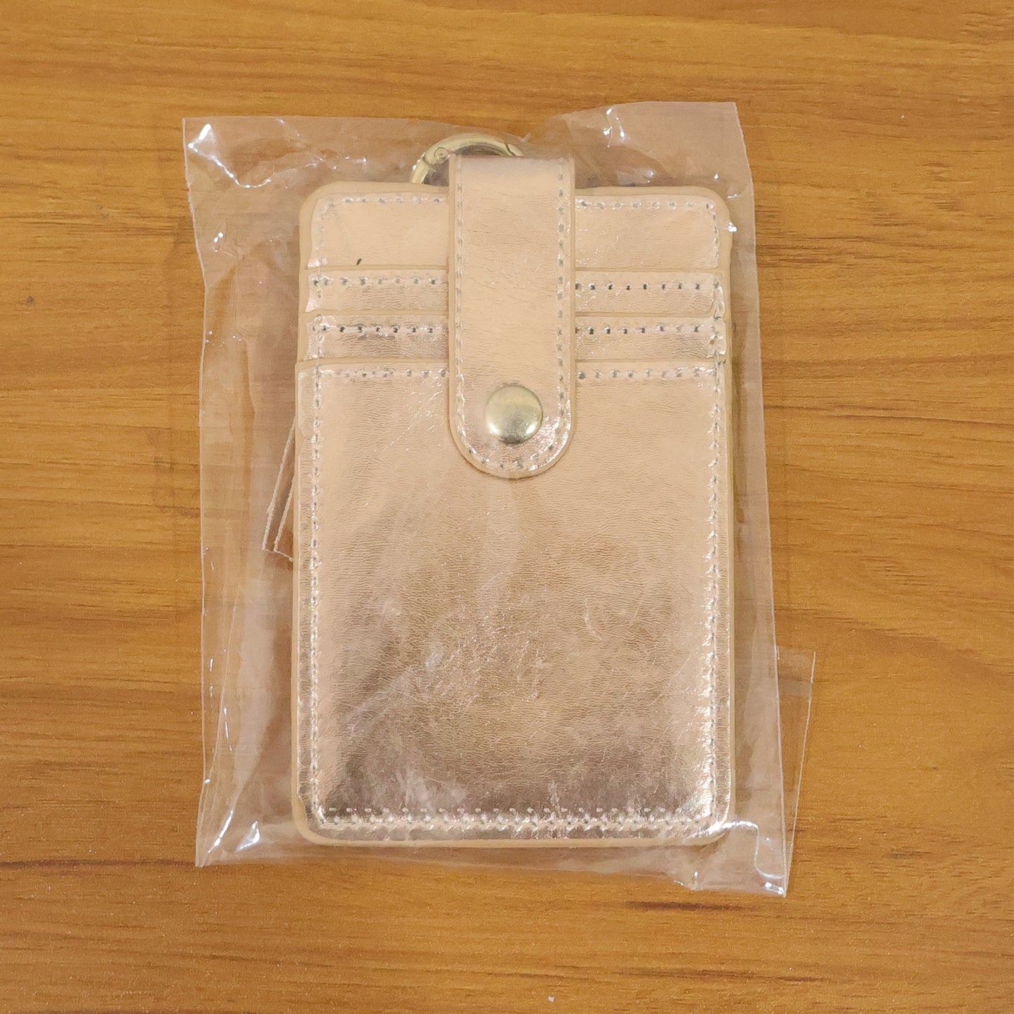 Wukusy PU leather card holder wallet with button strap, featuring multiple card slots and compact design for easy carrying.