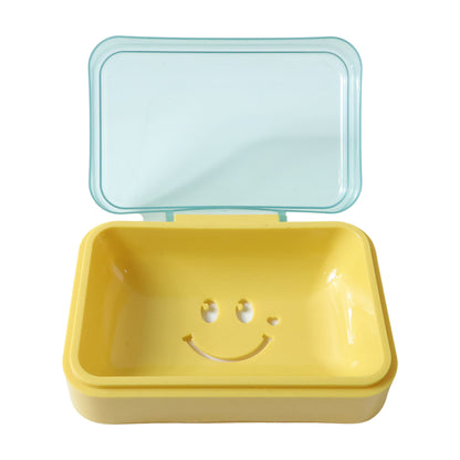 Pink plastic soap case with a cute yellow smiley face design, perfect for storing soap and keeping it dry.