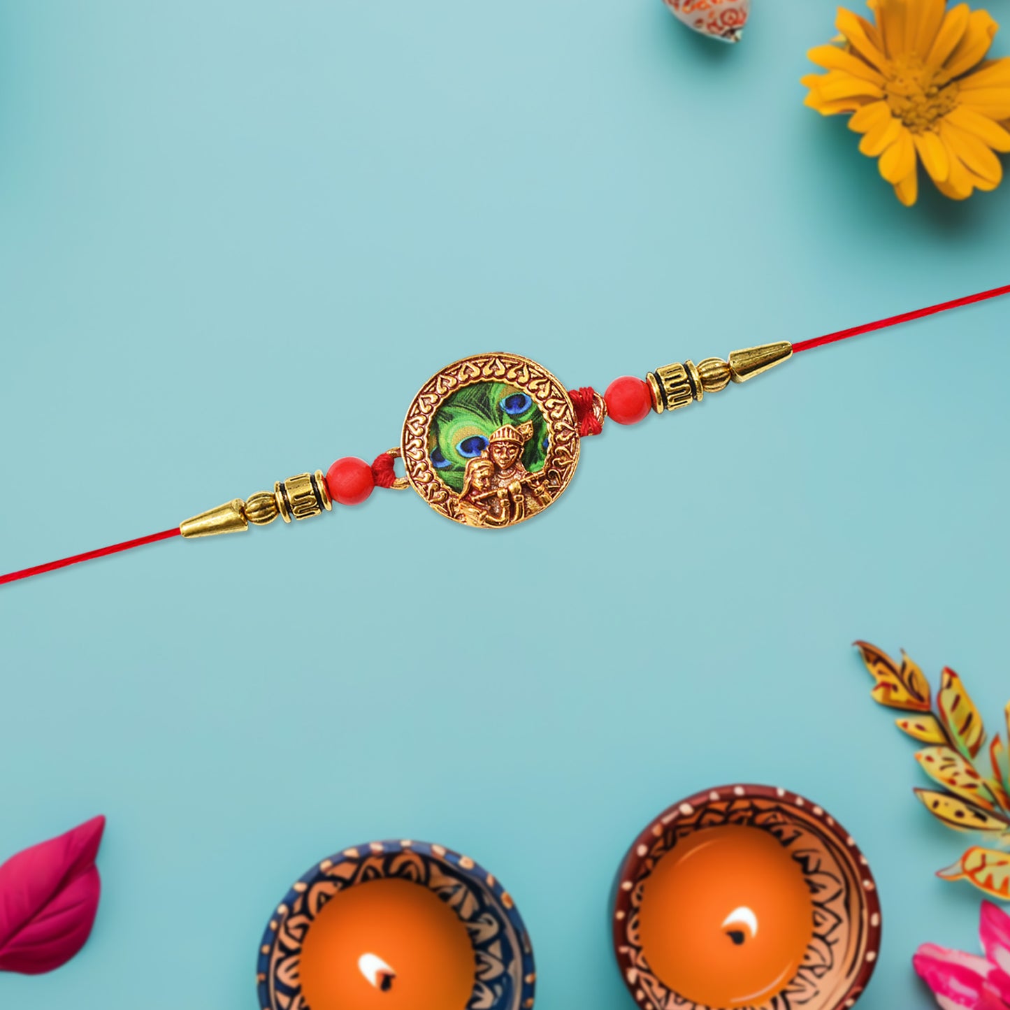 Traditional Krishna Rakhi with peacock feather design, decorative beads, on red thread, by Wukusy, for festive Raksha Bandhan celebrations