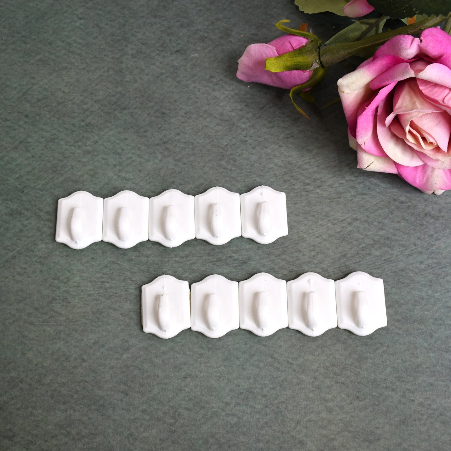 Set of 10 Wukusy small adhesive hooks for wall hanging, perfect for home and kitchen organization. Clear, easy-to-apply hooks.