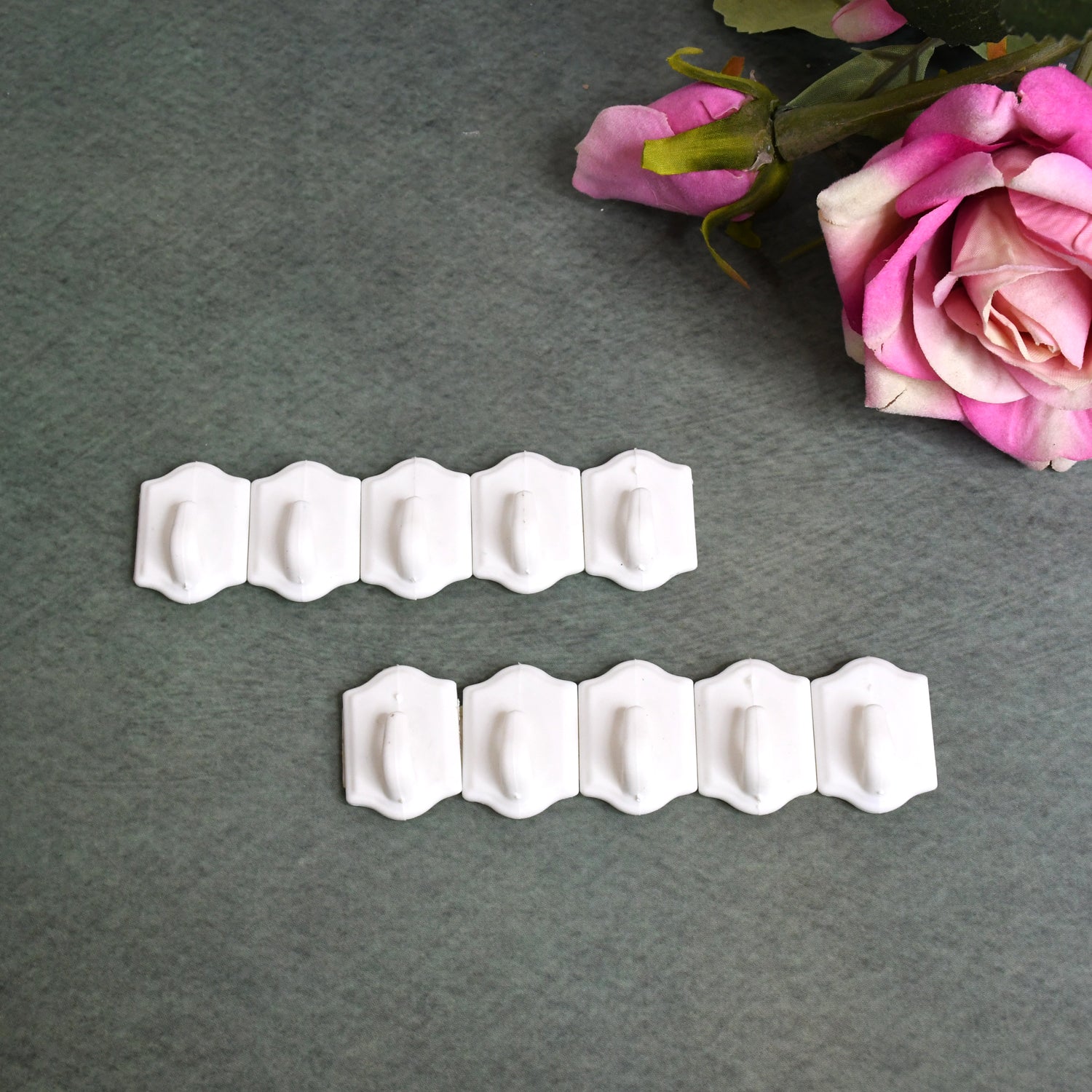 Set of 10 Wukusy small adhesive hooks for wall hanging, perfect for home and kitchen organization. Clear, easy-to-apply hooks.