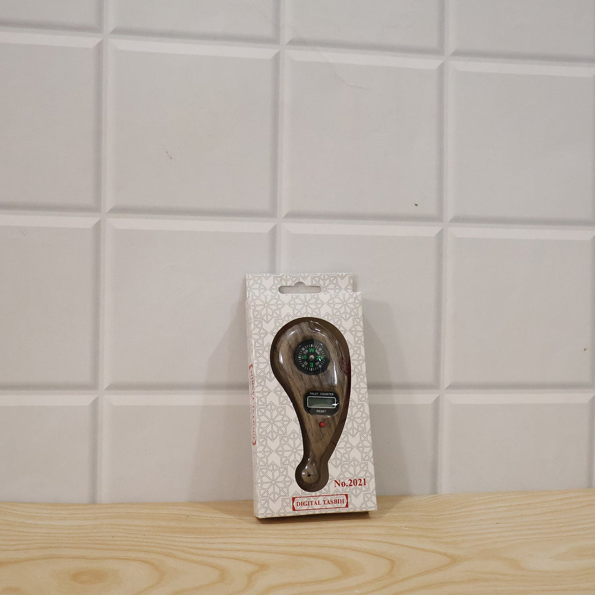 Wukusy wooden digital tasbih counter with LCD display, handheld mantra jaap counter, includes compass, showing close-up of device with wooden finish.