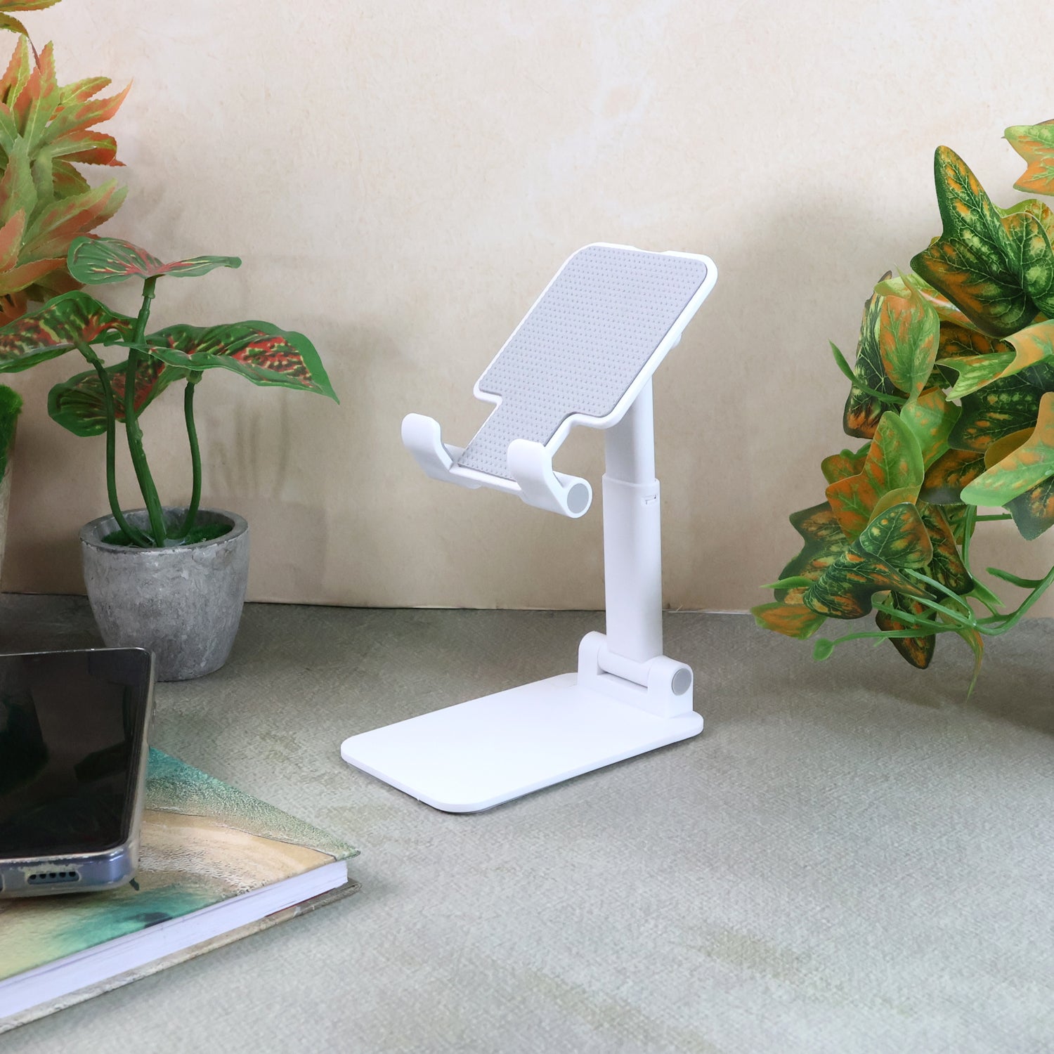 Adjustable foldable desktop mobile stand by Wukusy supporting smartphones for hands-free viewing.