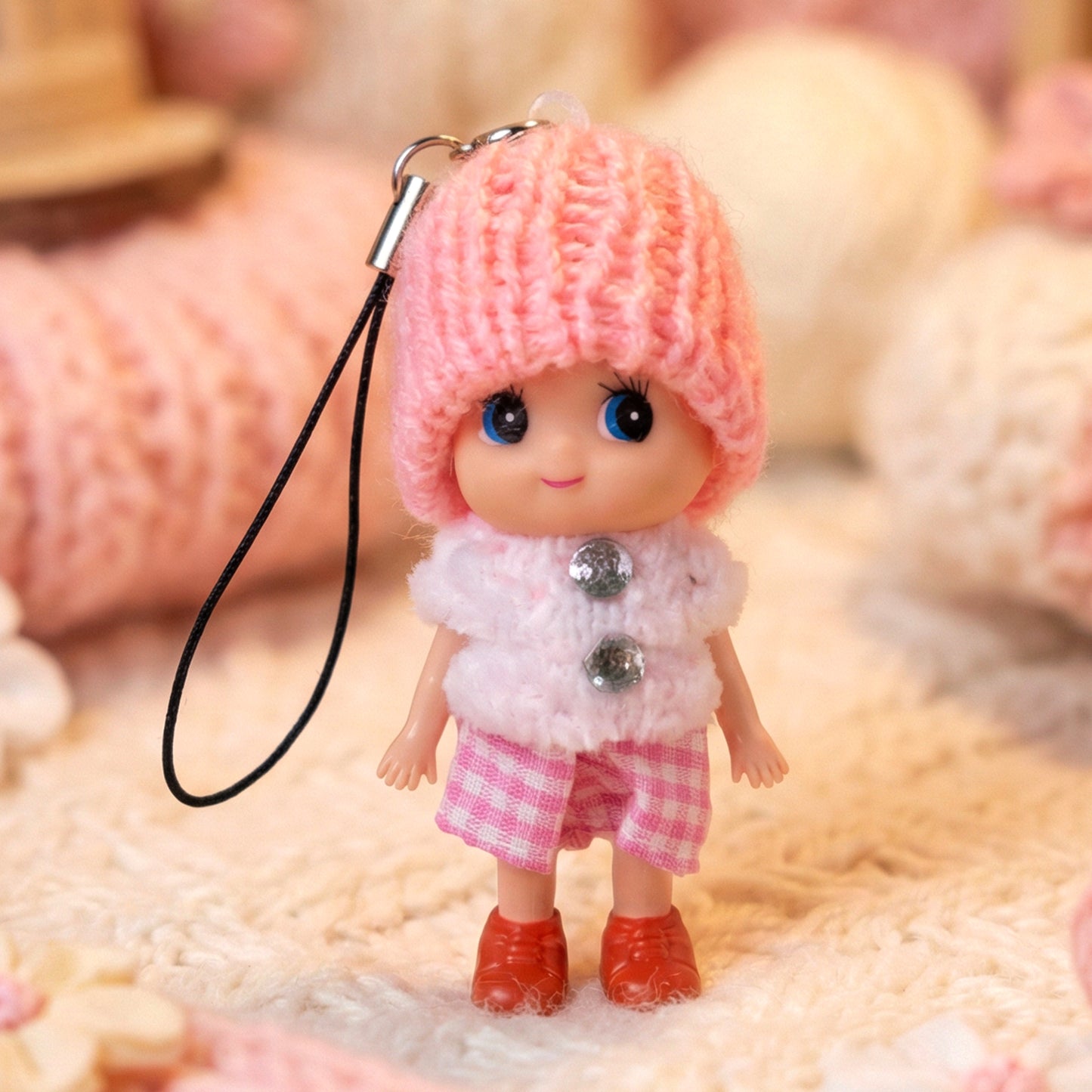 Cute mini doll keychain by Wukusy featuring a soft knitted cap girl charm in mixed colors, perfect for keys or bags.