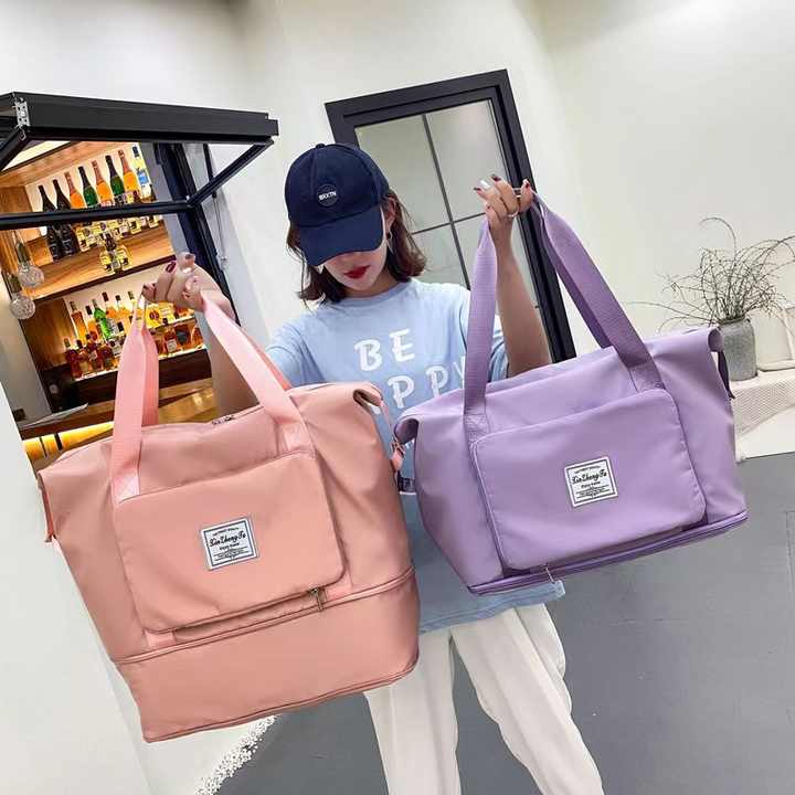 Women's multifunctional travel duffle bag by Drpshippr, featuring spacious design and sturdy handles for versatile travel use.
