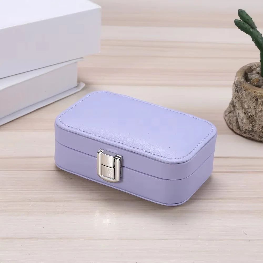 Drpshippr travel jewelry case with compartments for organizing necklaces, rings, and earrings during travel.