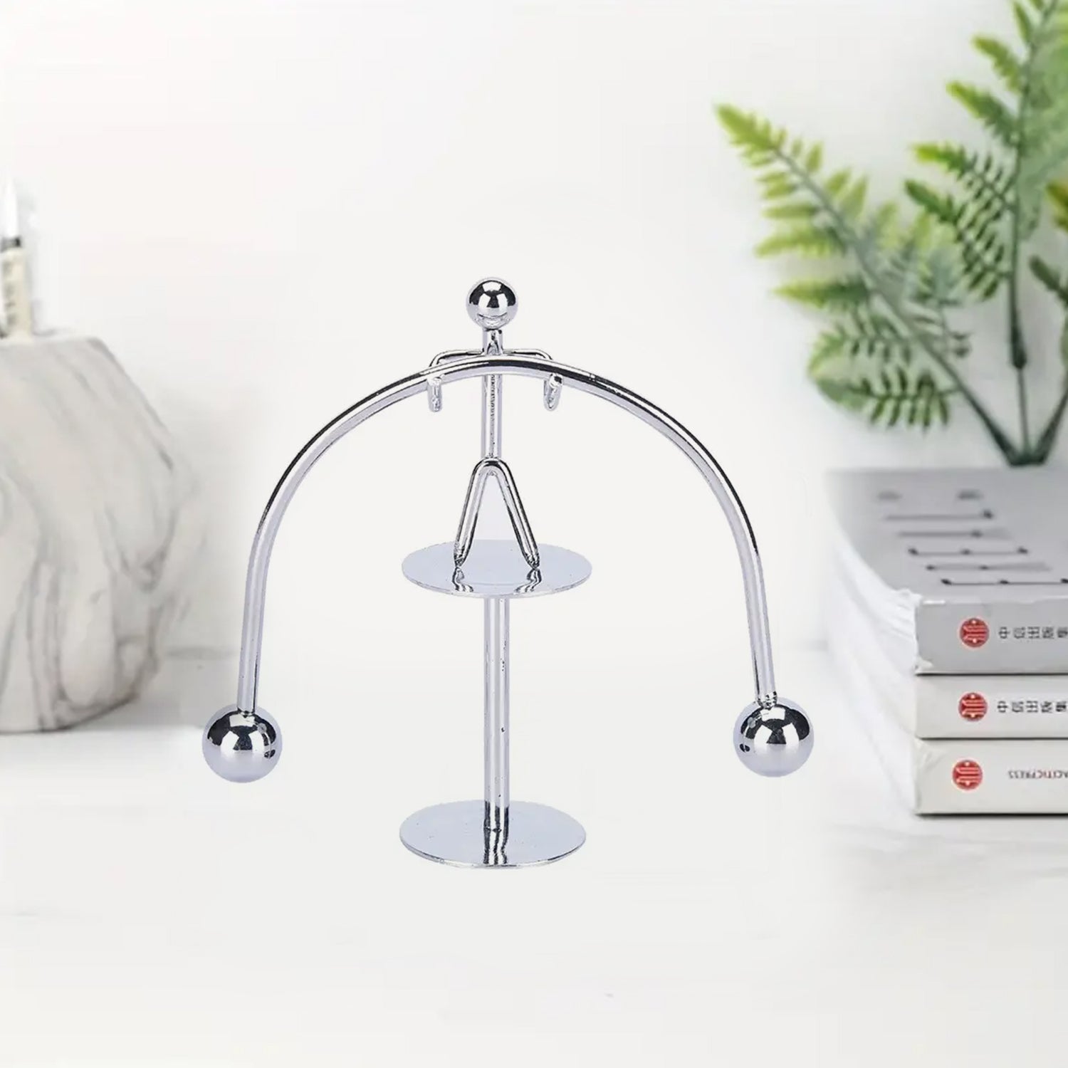 Wukusy 7850 Mini Steel Balance Toy small metal weightlifter figurine for desk decor and educational balance art display.