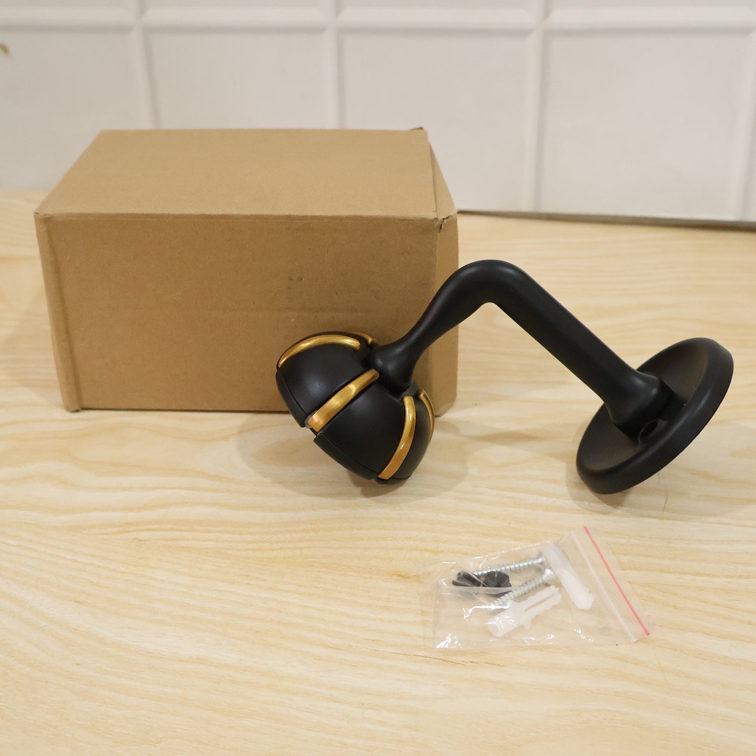 Wukusy heavy duty wall-mounted multi hook for keys, bags, clothes, and jewelry, securely attached to a wall.