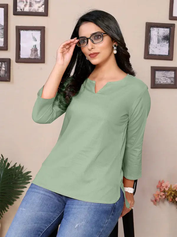 Baby pink cotton women's tunic with v-neck, hip length, and 3/4 sleeves, featuring a round neckline and casual style.