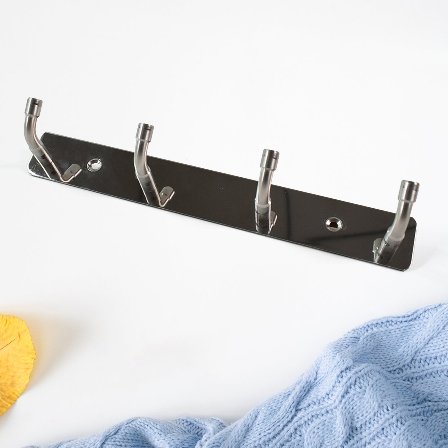 Wukusy stainless steel wall-mounted coat rack with four hooks, ideal for home entryways and kitchen organization.