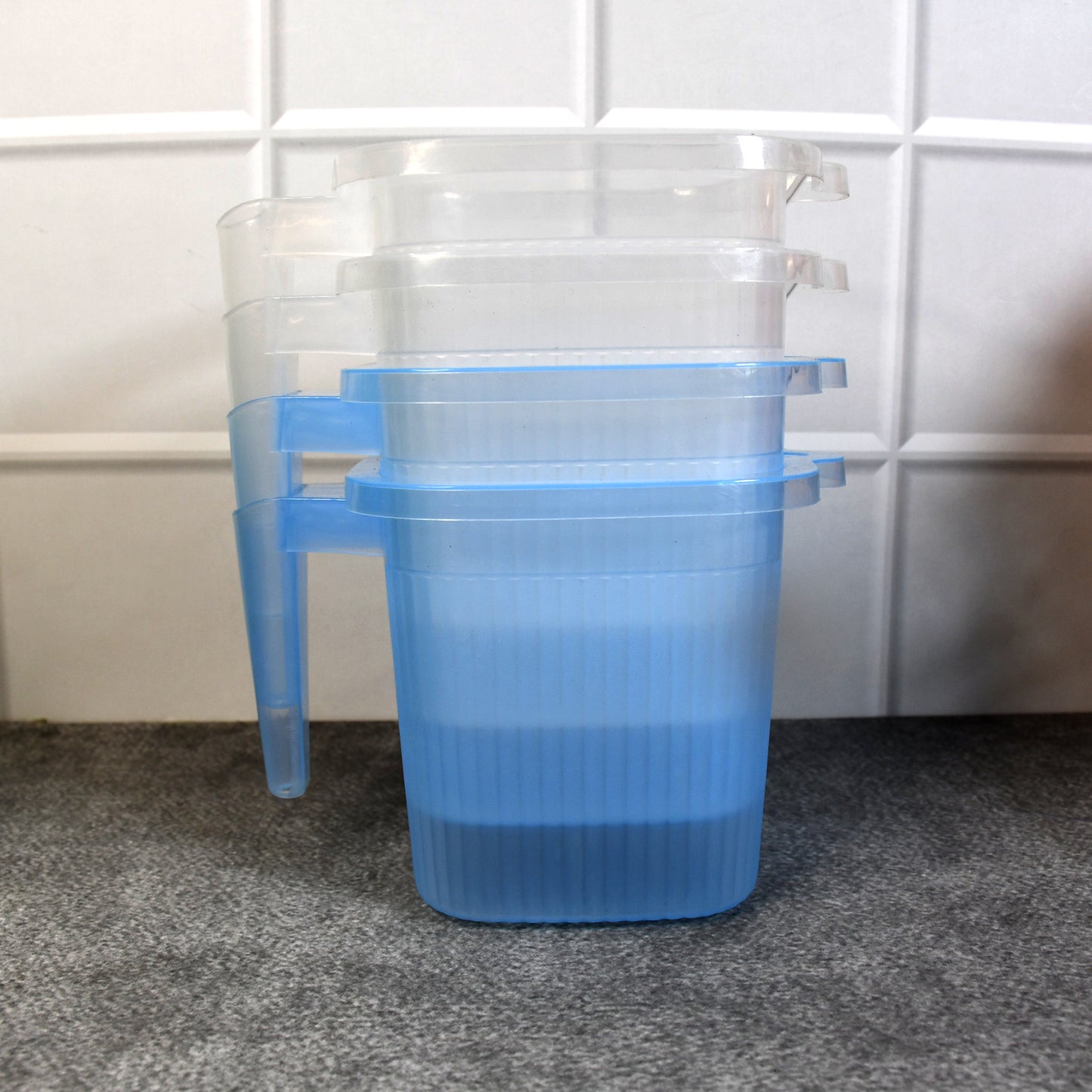 Set of four transparent plastic bathroom water mugs in mixed colors, each with a 1000 ml capacity, by Wukusy.