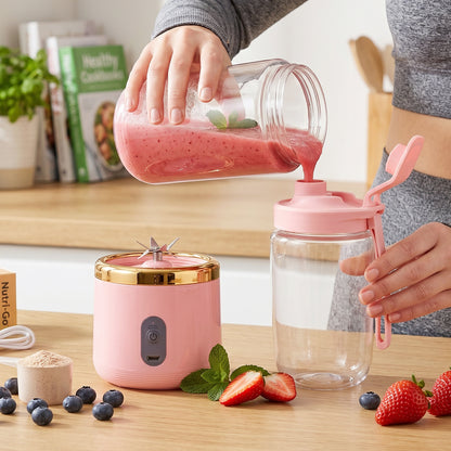 Wukusy portable electric cordless juicer with USB recharge, compact design ideal for on-the-go fresh juice blending.