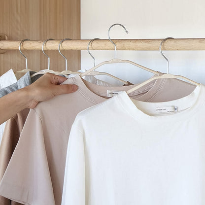 Wukusy PP cloth hanger with zinc-plated steel hook, single durable home improvement hanger for clothing organization.