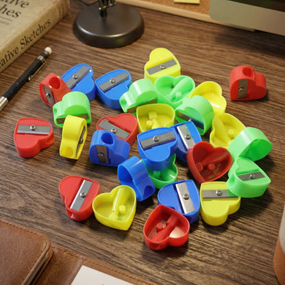 Wukusy heart-shaped pencil sharpener set with 28 colorful sharpeners in various sizes, designed for easy and fun pencil sharpening.