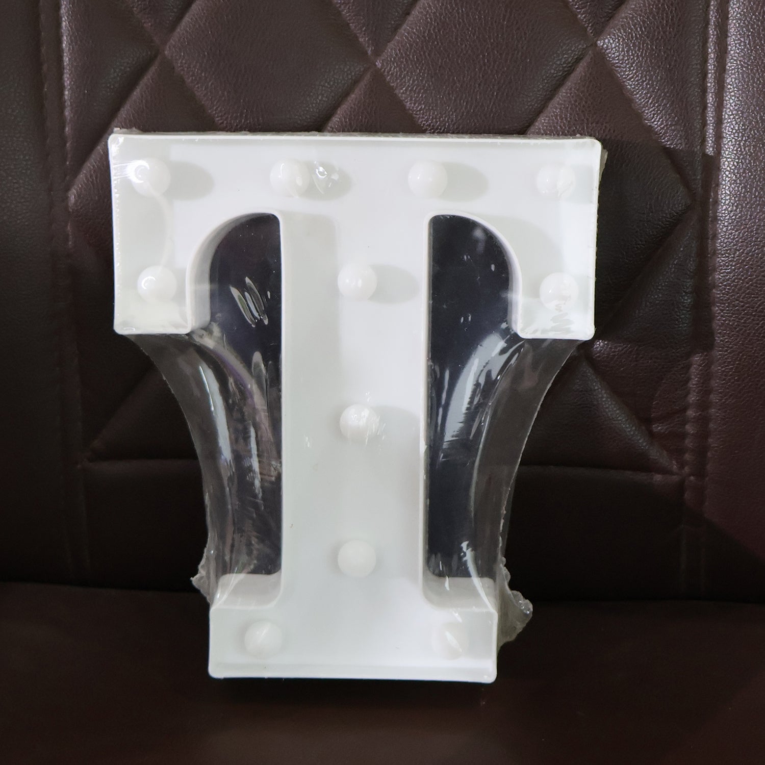 Wukusy decorative LED marquee letter light in the shape of the letter T, ideal for home decor, illuminated and stylish.