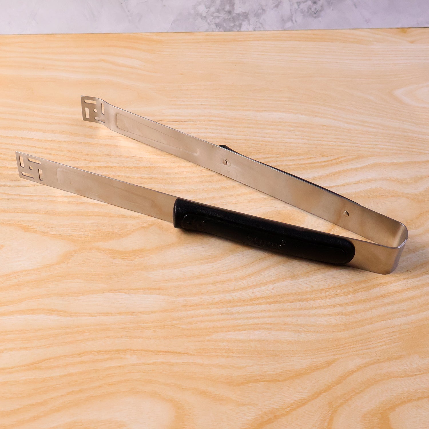 Premium stainless steel chimta by Wukusy, showcasing a durable, traditional kitchen tong with a shiny finish and ergonomic handle.