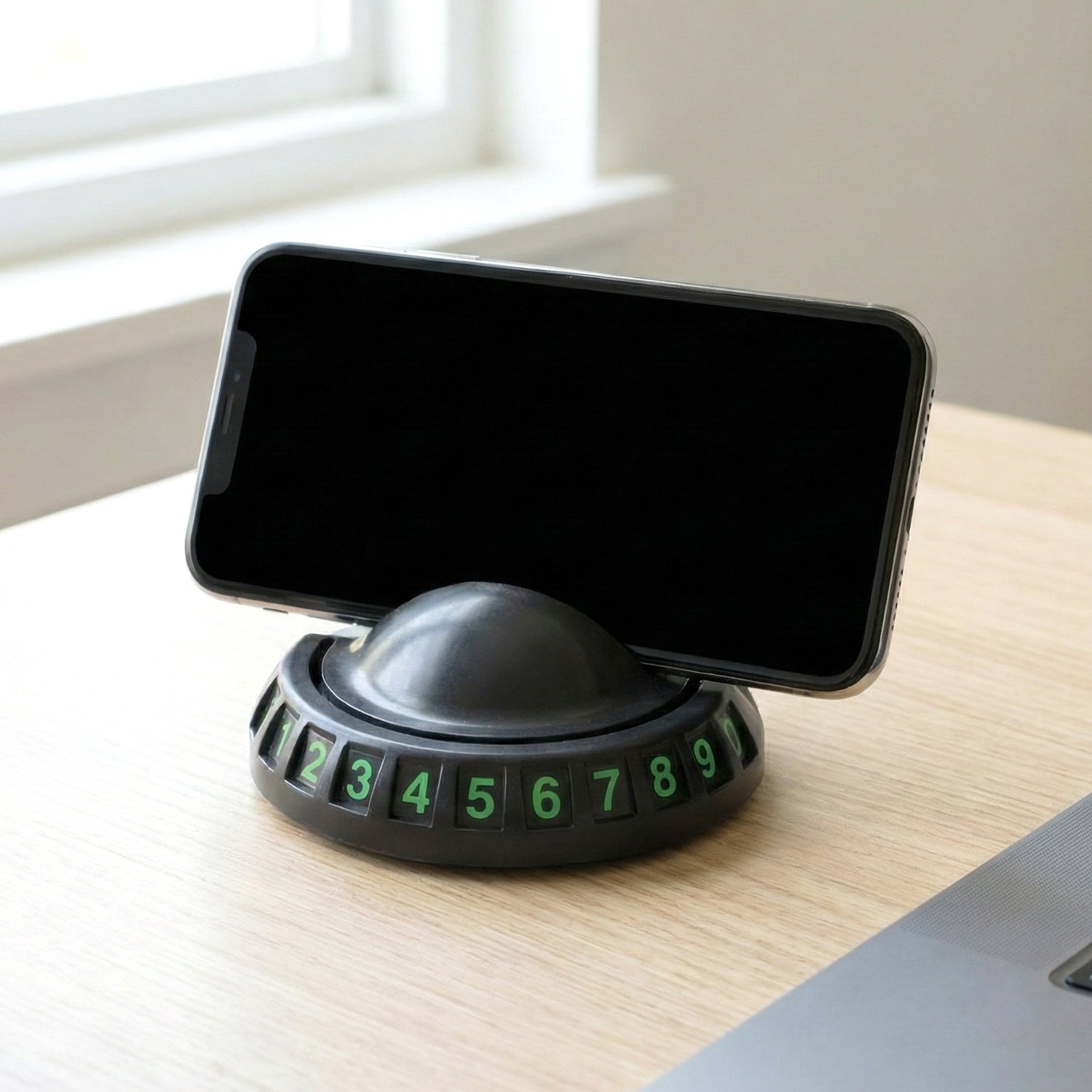 Wukusy 360° rotating anti-slip car dashboard mobile phone holder securely holds a smartphone in a car dashboard mount.