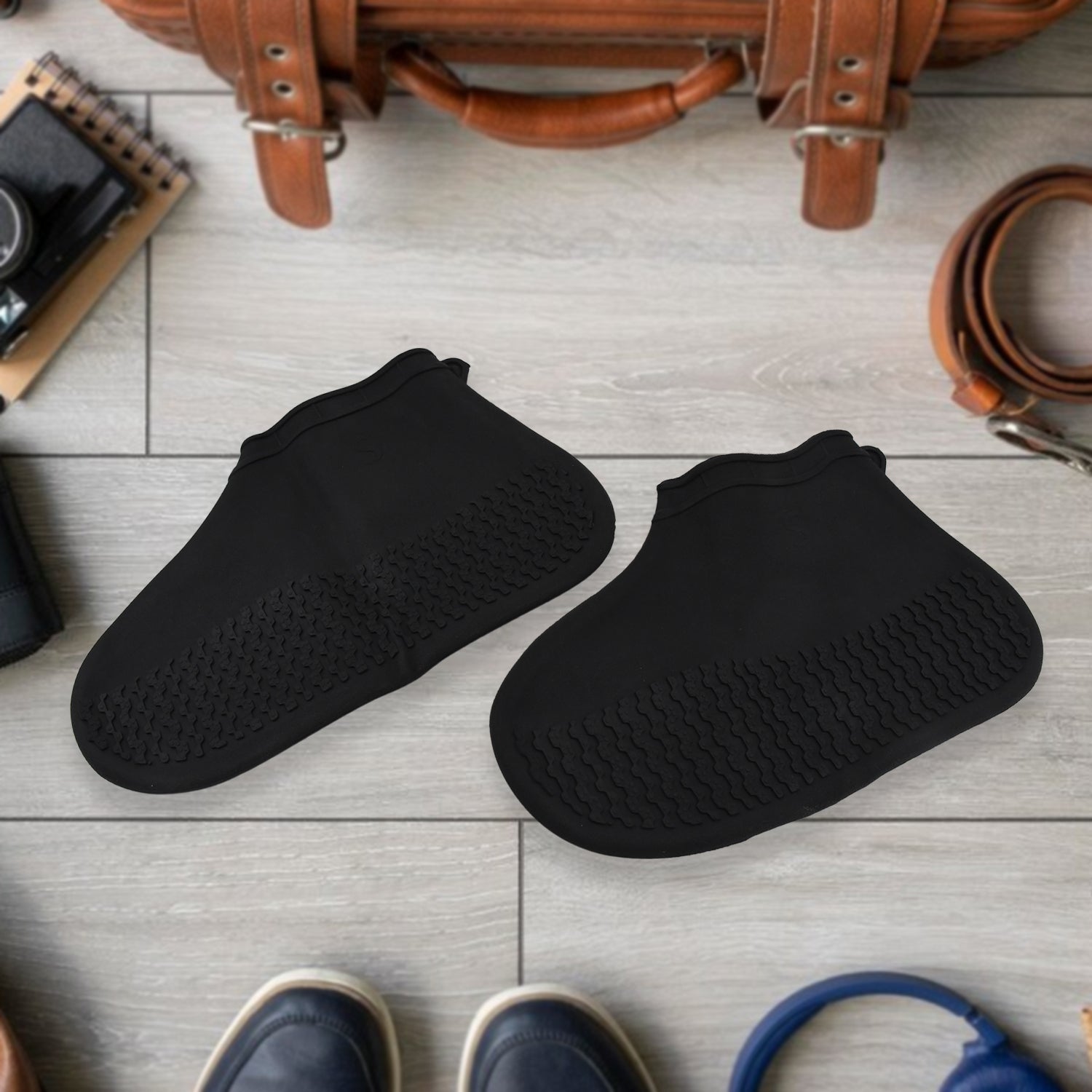 Pair of Wukusy non-slip silicone rain boot covers in small size, waterproof and reusable, designed to keep shoes dry and skid-proof.