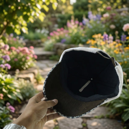Wukusy stylish women's cat ear designer cap with pink and black fabric, featuring cute cat ear details, worn by a woman model.