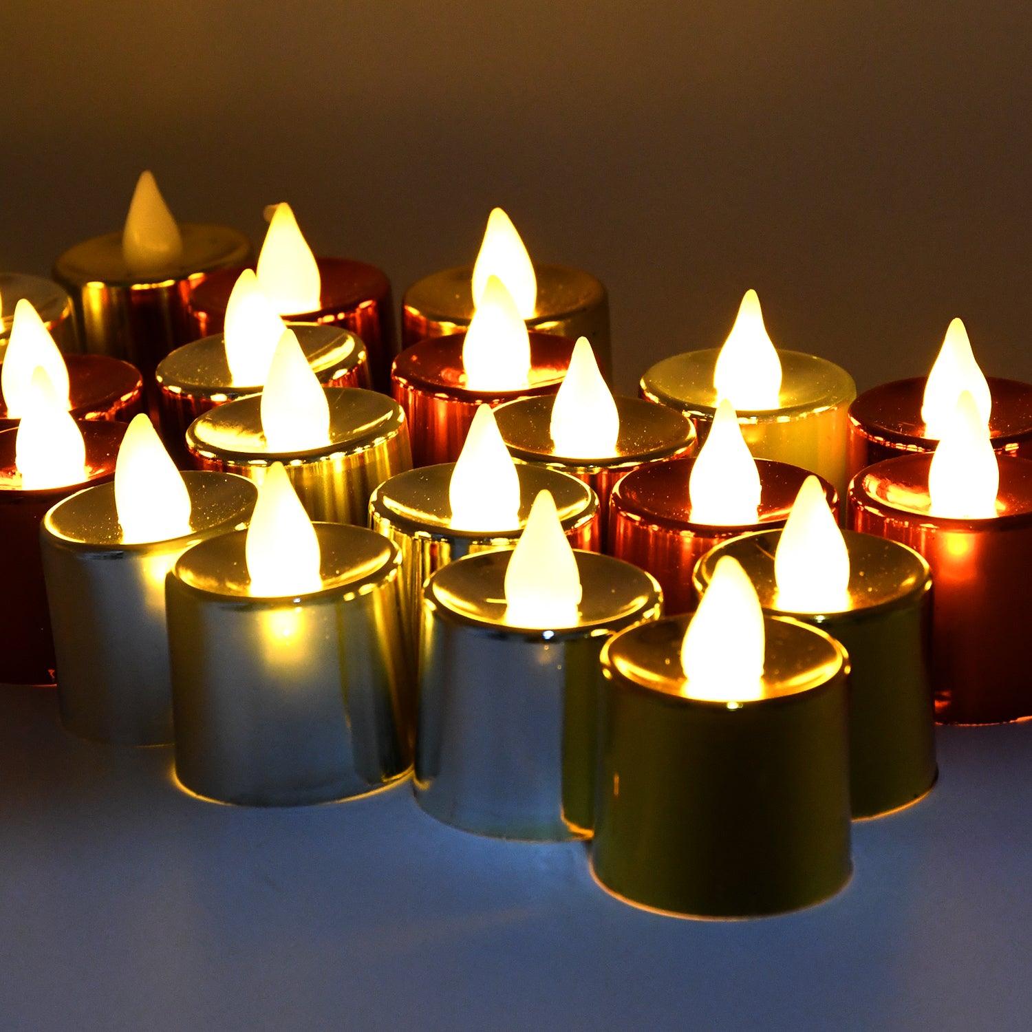Set of 24 Wukusy LED plastic tea light candles with electrical diya design for home decor and lighting.