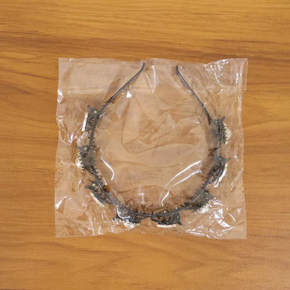 Stylish black and gold finish decorative headband by Wukusy, featuring a sleek design with elegant gold accents for women.