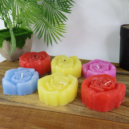 Set of six rose-shaped wax candles by Wukusy, elegant home decor with detailed petal design and warm candle holders.