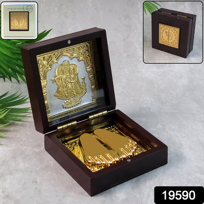 Golden Charan Paduka in wooden box, a spiritual home decor accessory with intricate design, crafted by Wukusy for religious offerings.