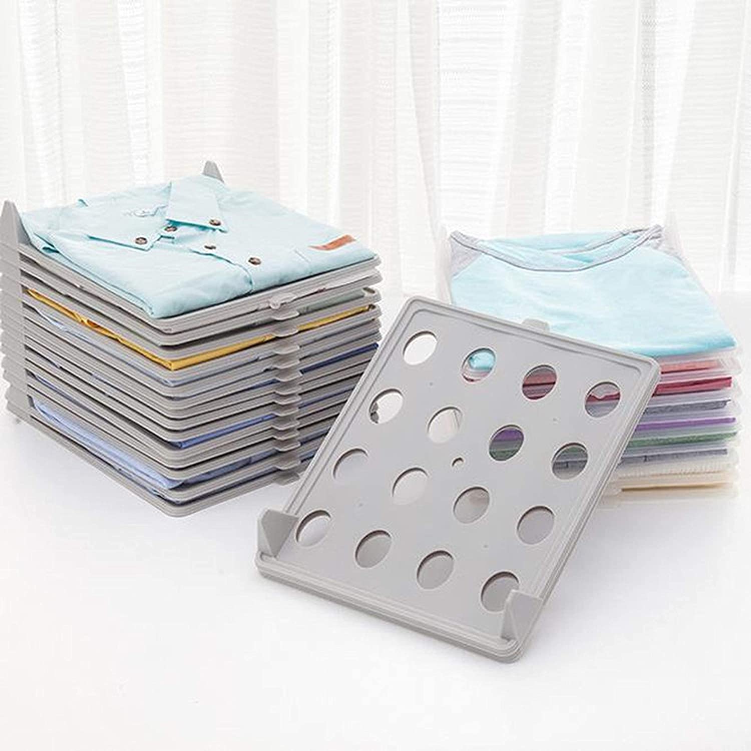 Wukusy cloth organizer for household use, shown holding neatly folded fabrics and clothes in a home decor setting.