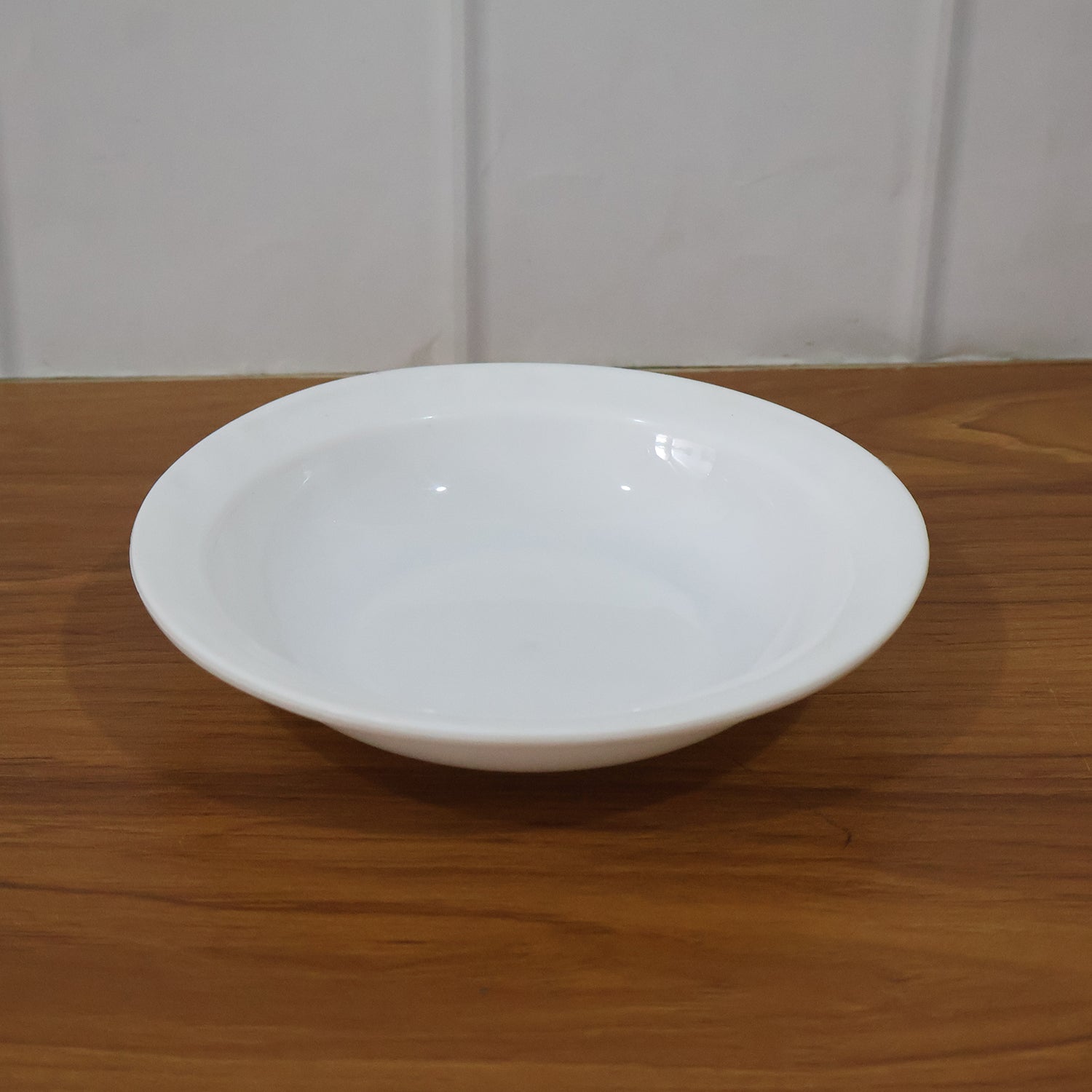 Deep round curry bowl by Wukusy, featuring a smooth ceramic surface and classic design, perfect for serving delicious dishes.