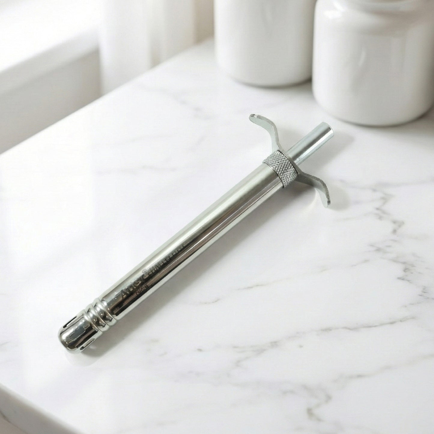 Wukusy manual stainless steel gas stove spark lighter with ergonomic handle and ignition button for easy lighting.