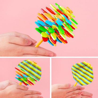 Colorful Spin Flower Candy rotating toy by Wukusy, featuring a spinning flower design for kids' entertainment.
