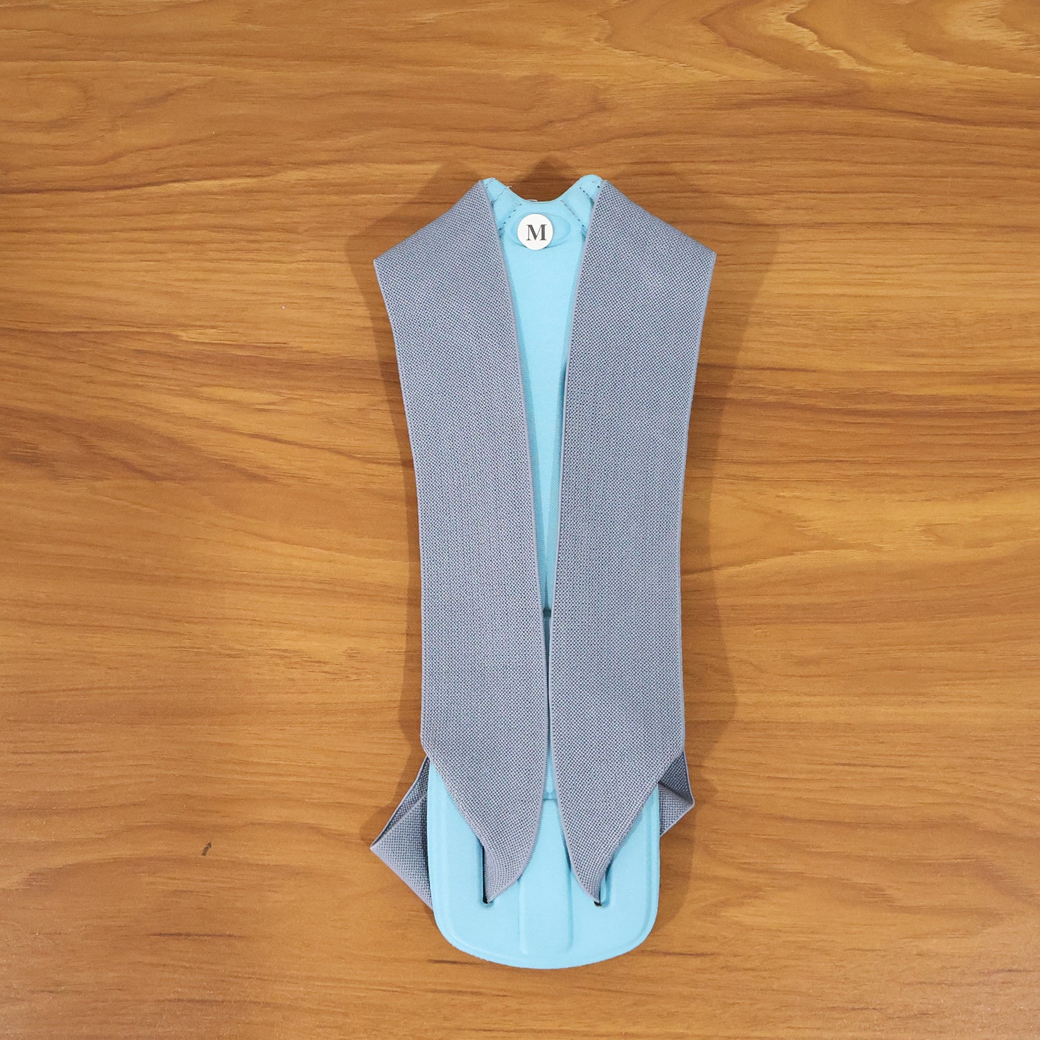 Wukusy ergonomic adjustable back posture corrector belt in medium size, supporting proper spinal alignment and posture.
