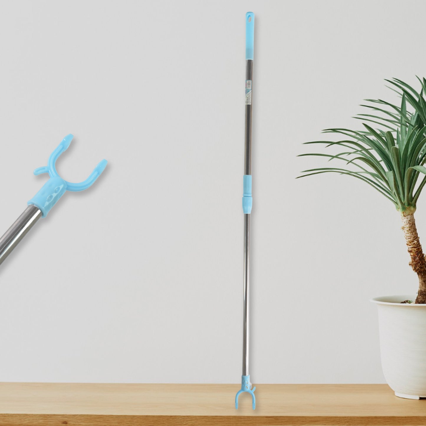 Stainless steel telescopic pole clothes hook hanger by Wukusy, extended to 1 meter, showing versatile hanging and clothes organization.