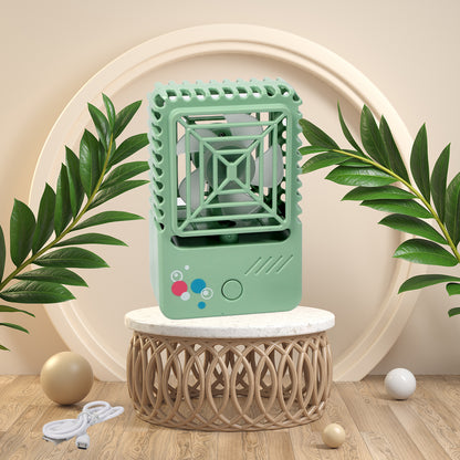 Wukusy 7608 mini desktop rechargeable fan, handheld USB desk fan with adjustable blades for home, office, or travel cooling.