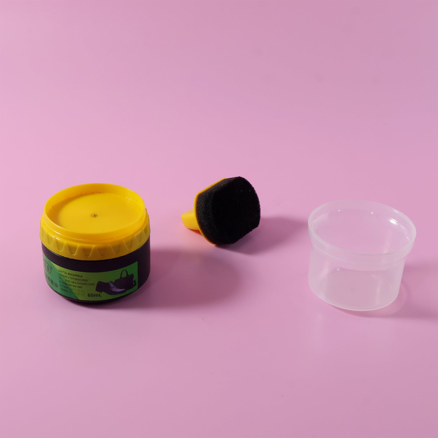 Black Wukusy shoe polish cream with built-in sponge applicator, 60 ml, for easy shoe shine and leather care.