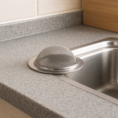 Wukusy Supermom stainless steel sink strainer in a kitchen sink, designed to trap debris and prevent clogs.