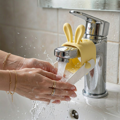Wukusy cute faucet water tap extender for kids, plastic device attached to a bathroom sink faucet for easy water flow.