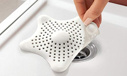Wukusy silicone star-shaped sink filter with hair catcher for bathroom basin drain, made of flexible, durable material.