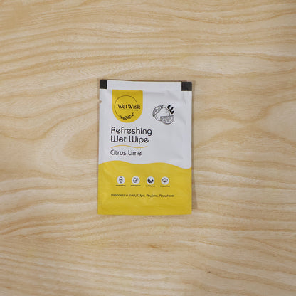 Wukusy Citrus Lime refreshing wet wipe for face, hands, and body with fresh cleansing properties, showing the wipe and citrus fruits.