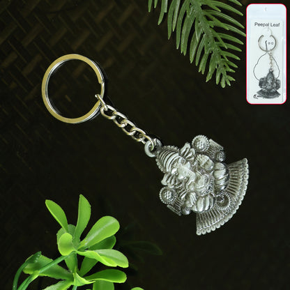 Silver Lord Ganesha sitting design keychain from Wukusy, featuring intricate Hindu deity craftsmanship in a compact accessory.