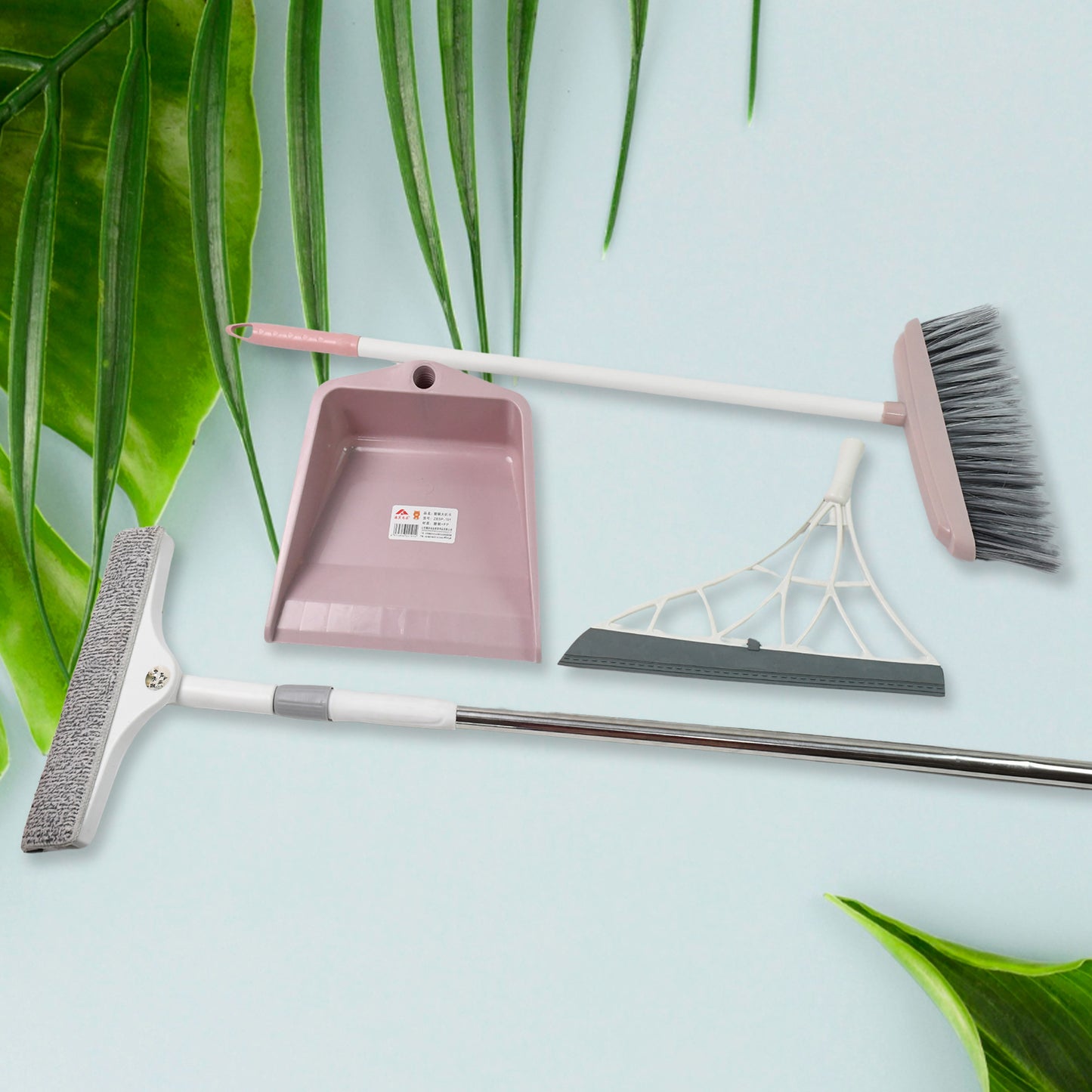 Set of 4 Wukusy dustpan and kitchen wiper squeegee tools with broom brushes for window and floor cleaning.