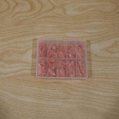 Wukusy artificial nail tips set for salon-style manicures, featuring various nail shapes and lengths on a neutral background.