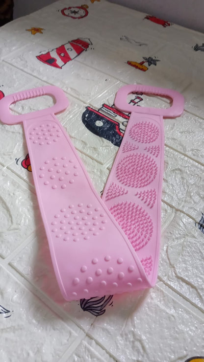 Wukusy 7274 eco-friendly silicone bath body brush towel and back scrubber for shower, showing textured surface and strap for grip.