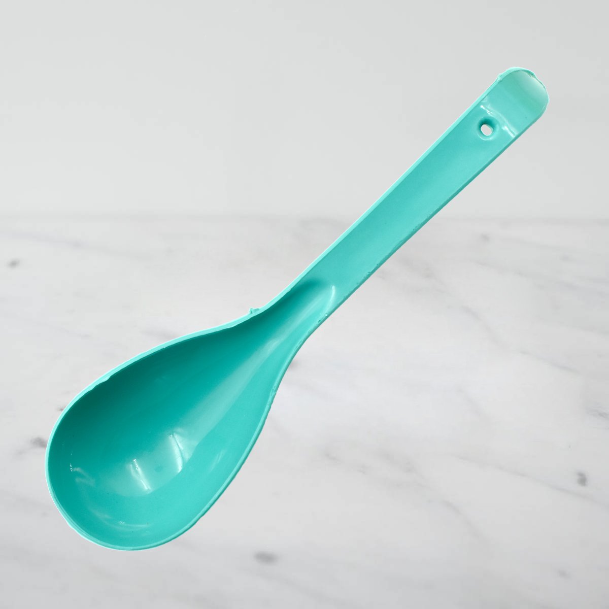 Wukusy plastic serving spoon for kitchen use, showcasing a durable, lightweight kitchen tool with a long handle and wide scoop.